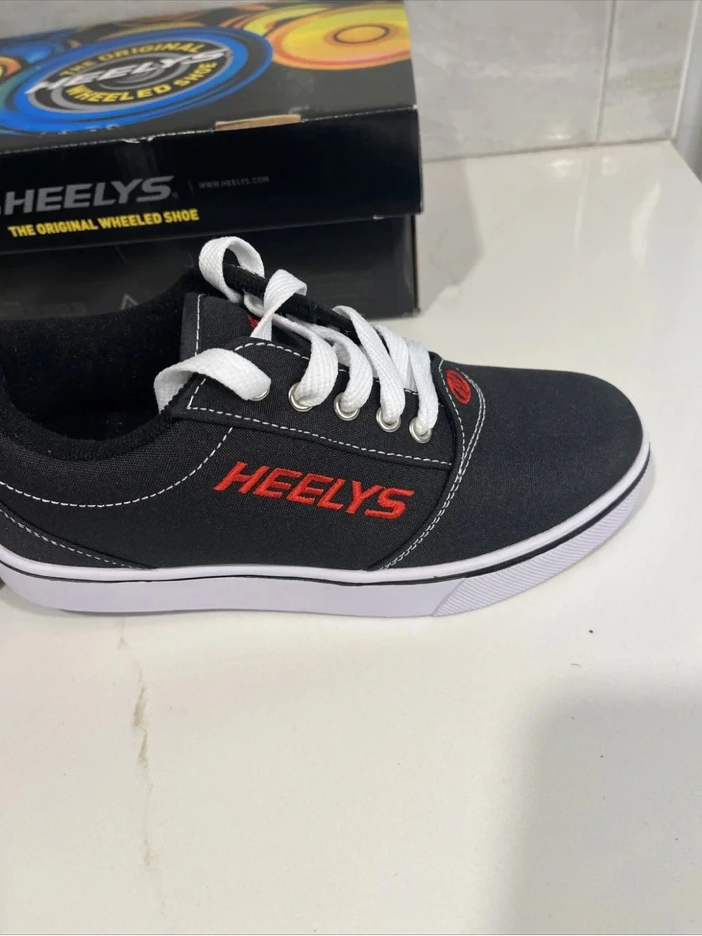 Heelys Black Canvas Sneakers with Red Accents and White Soles